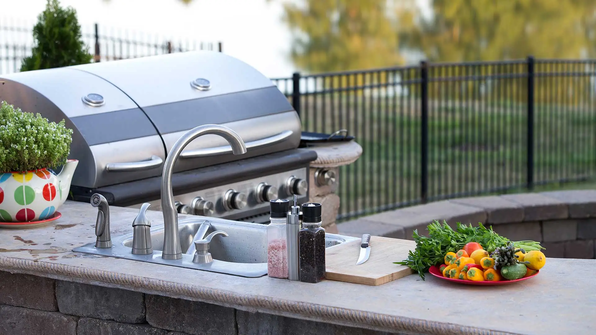 Custom outdoor kitchen with grill and countertops in Ankeny, IA.