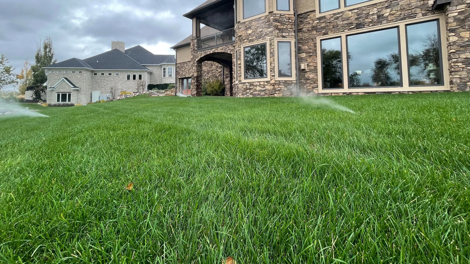 Home with retaining walls and flower beds in Ankeny, IA.