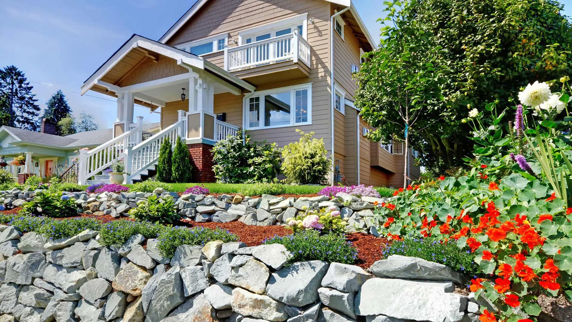 Home with retaining walls and flower beds in Ankeny, IA.