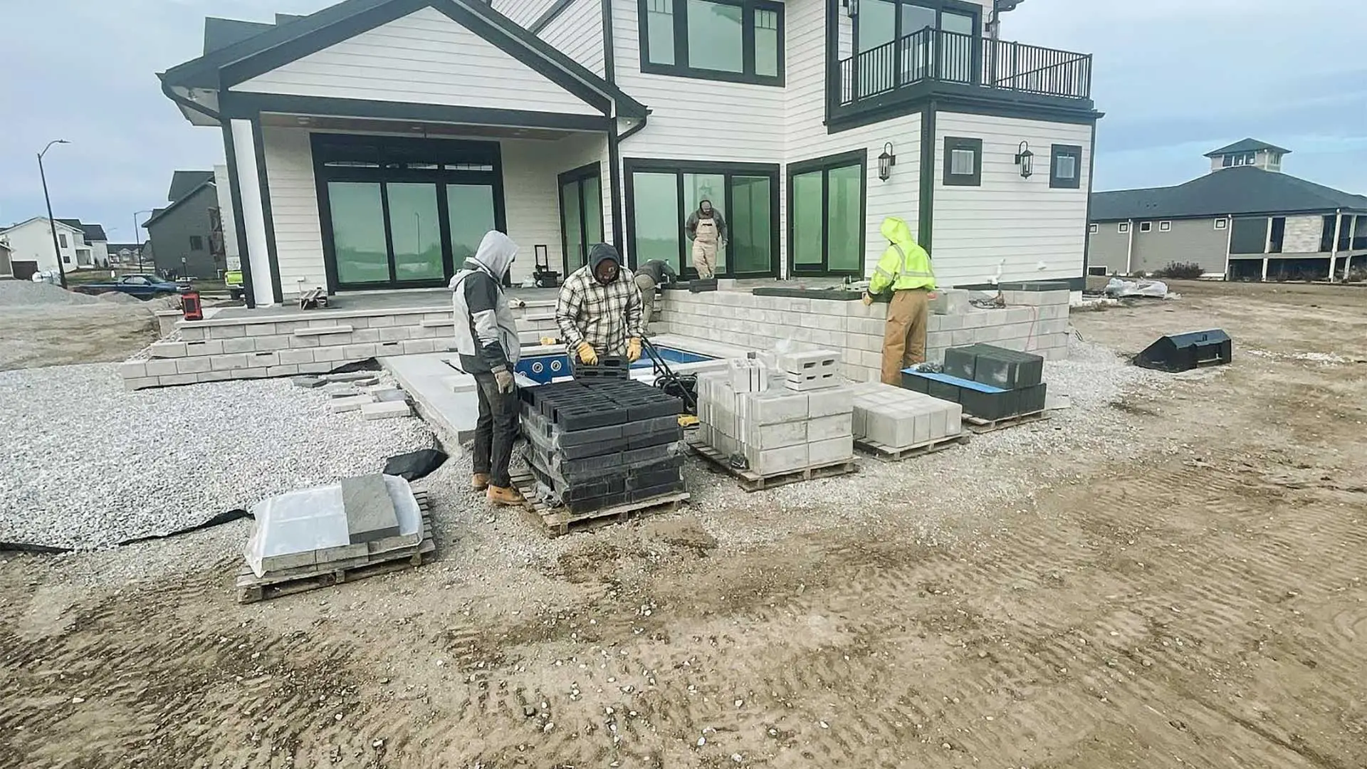 ETCH Outdoor Living crew constructing a patio in Ankeny, IA.