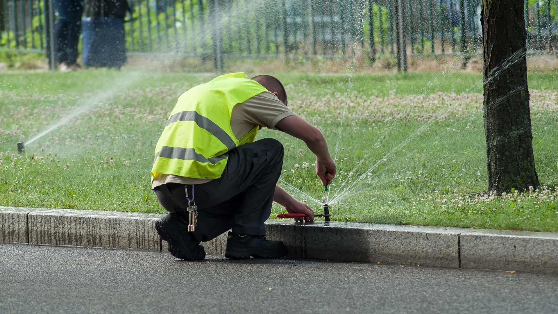 Technician maintaining sprinkler in Ankeny, IA.