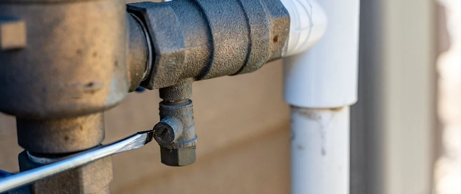 Adjusting an irrigation valve in Ankeny, IA.