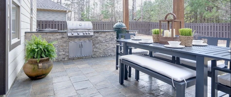 Dining set in an outdoor kitchen in Ankeny, IA.