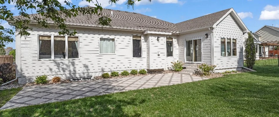 Outdoor space of a house in Ankeny, IA, with a patio and a lawn.