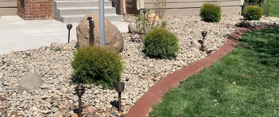 Landscape bed in Ankeny, IA, with rock ground cover.