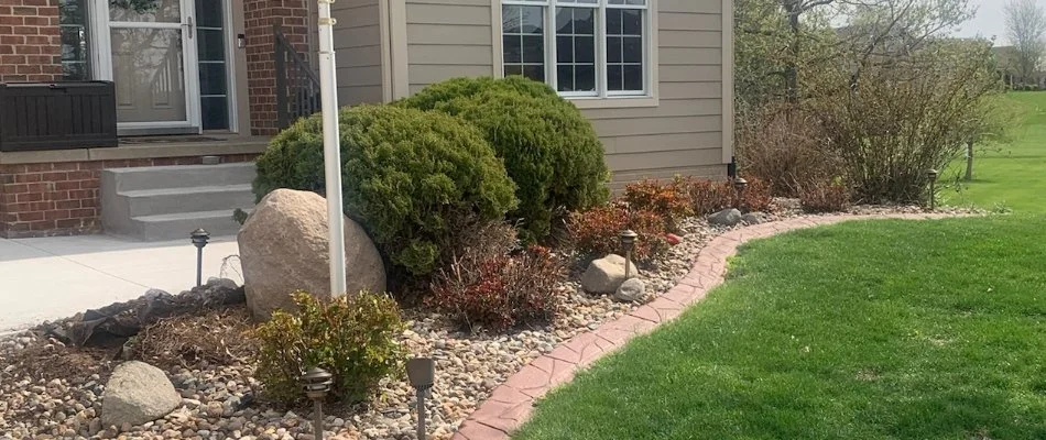 Landscape in Ankeny, IA, with shrubs and plants.