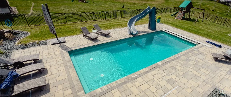 Swimming pool in Ankeny, IA, with a slide.