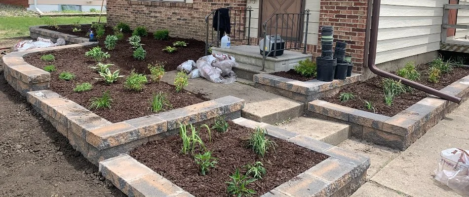 Tiered retaining wall with planter beds in Ankeny, IA.