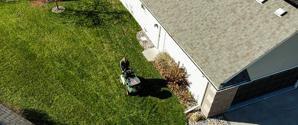 Aerial shot of a professional overseeding lawn in Des Moines, IA.