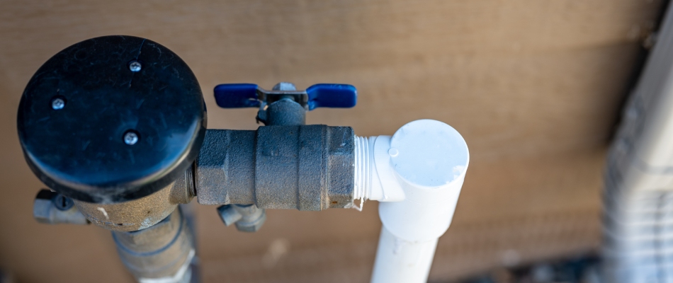 Backflow being checked during startup service in Johnston, IA.