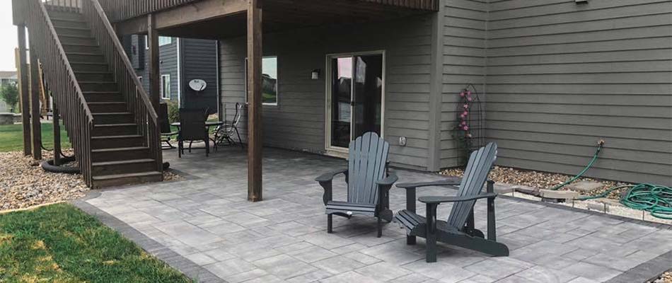 Custom patio under a raised deck near Ankeny, IA.