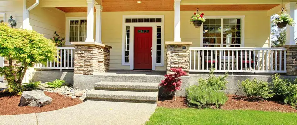 Landscape beds and mulch around a Saylorville, IA home's front porch.