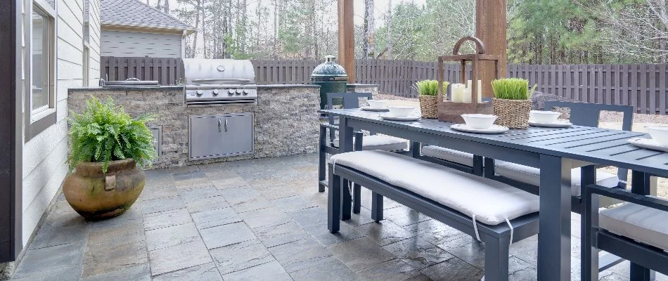 Outdoor kitchen with grill and green egg on a property in Ankeny, IA.