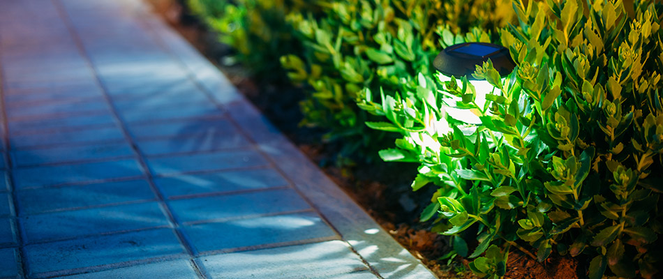 An outdoor light installed alongside a walkway in Johnston, IA.