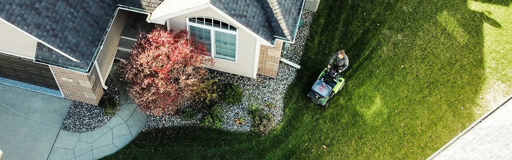 A professional servicing lawn with machinery in Polk City, IA.