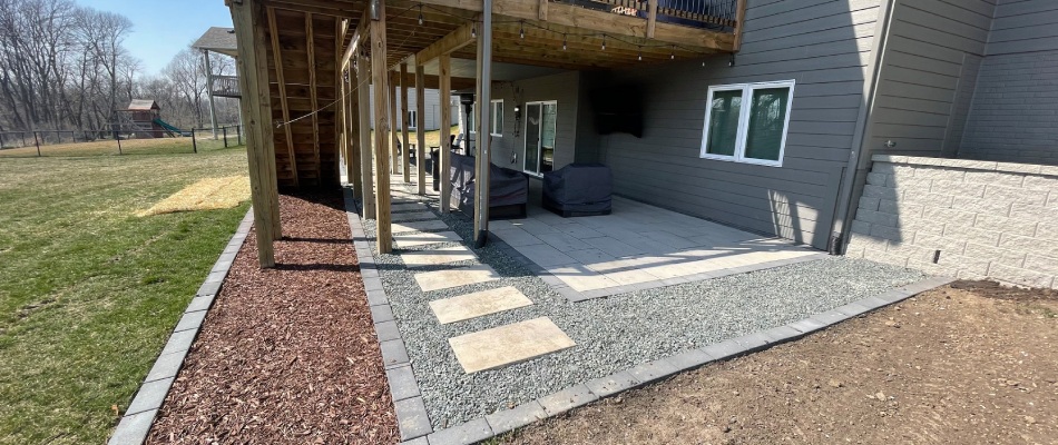 Patio installed under deck in Johnston, IA.
