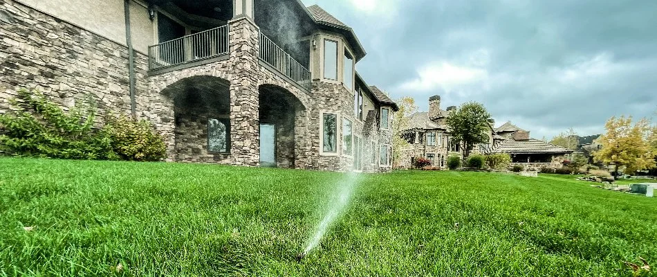 Irrigation system spraying water on a lawn in Tiffin, IA.